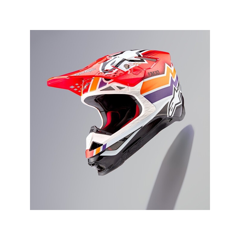 Motokrosová prilba Alpinestars Supertech S-M10 Edícia Troy Lee Designs oranžovo-žlto-fialovo-bielo čierna